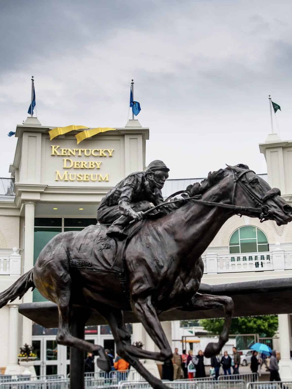Bronze horse racing statue outside Kentucky Derby Museum in Louisville, Kentucky.
