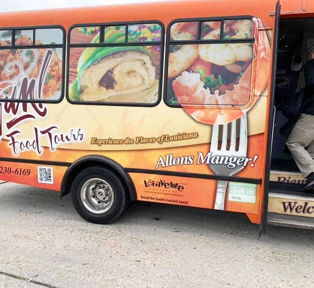Delicious Louisiana food truck with colorful images of rolled crepes and savory dishes.