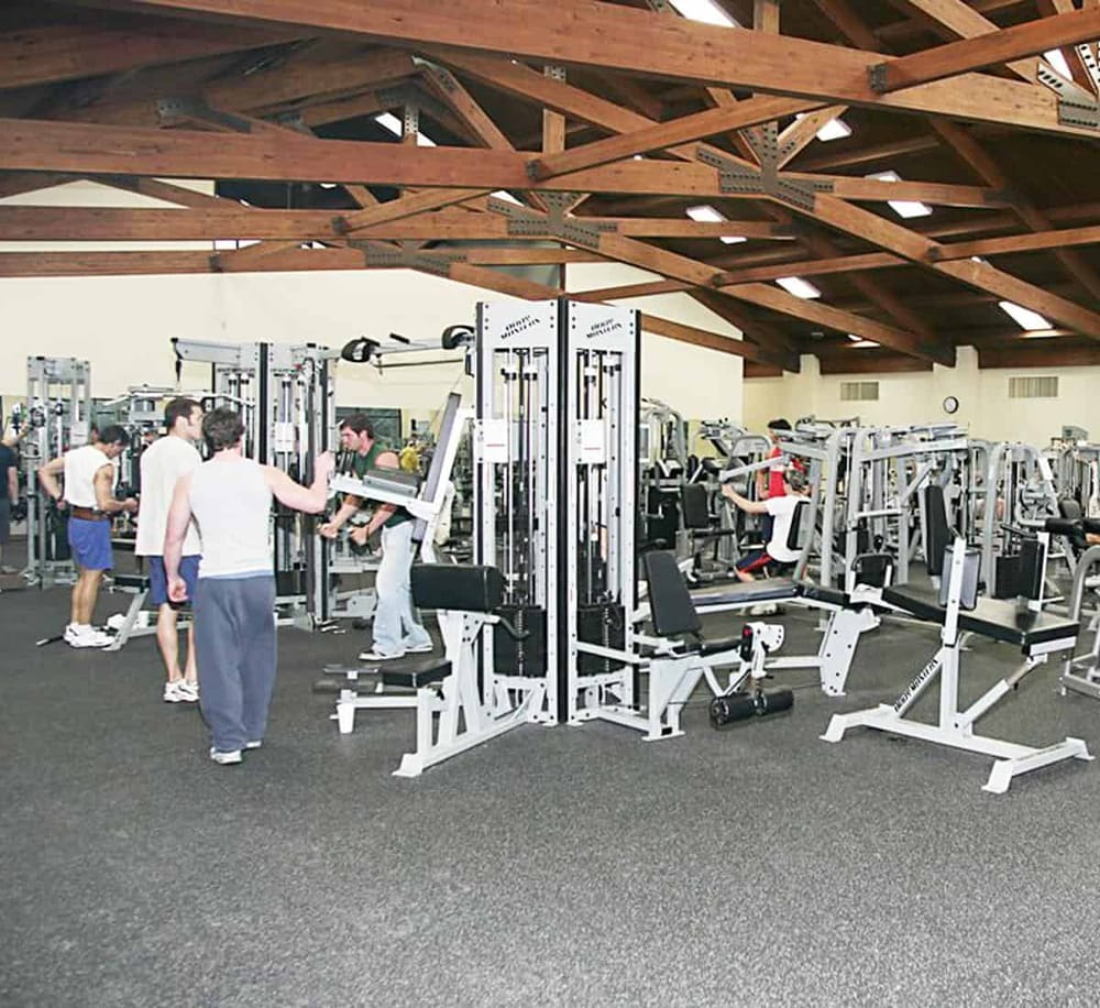 Weight training gym equipment at QuestForDirections fitness center, health, strength training facility.