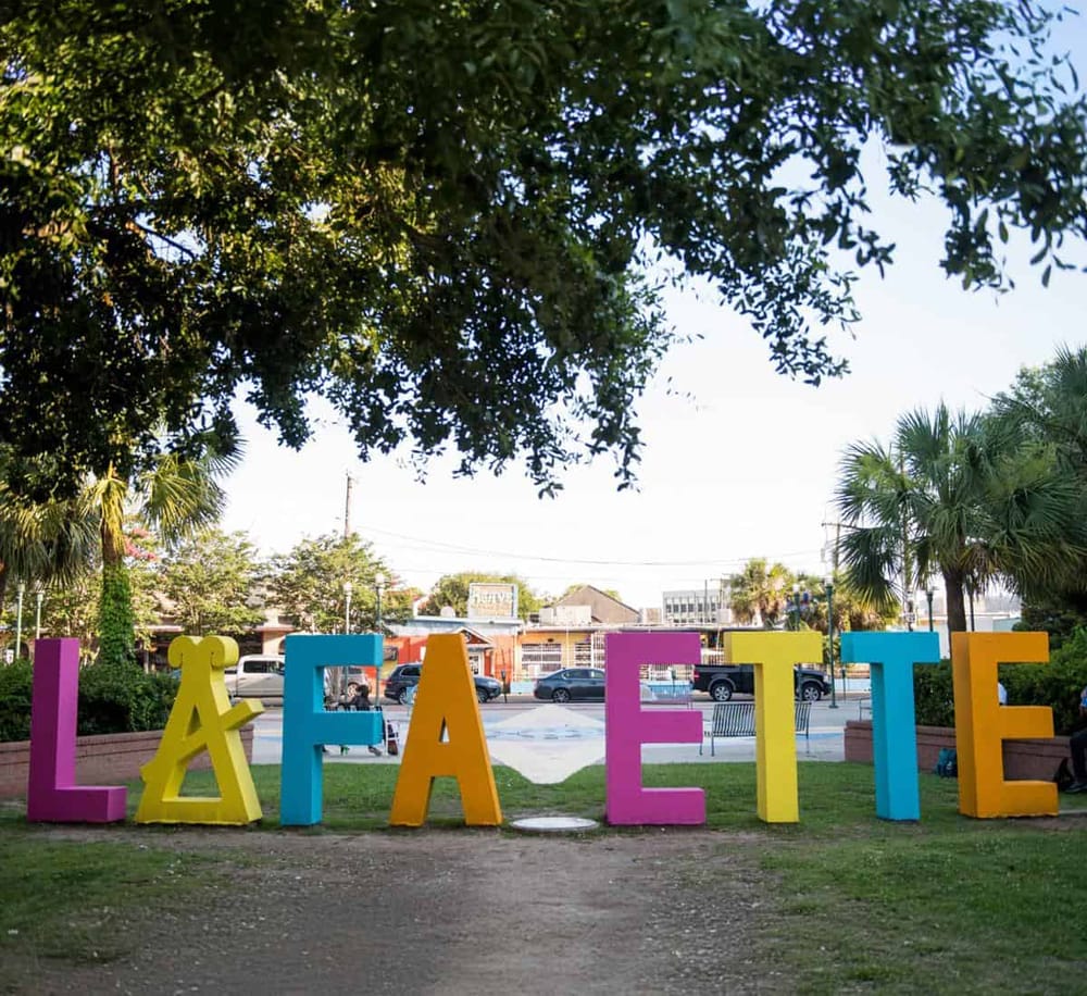 Colorful LA patio sign in an outdoor urban park setting, popular for community gatherings and local events.
