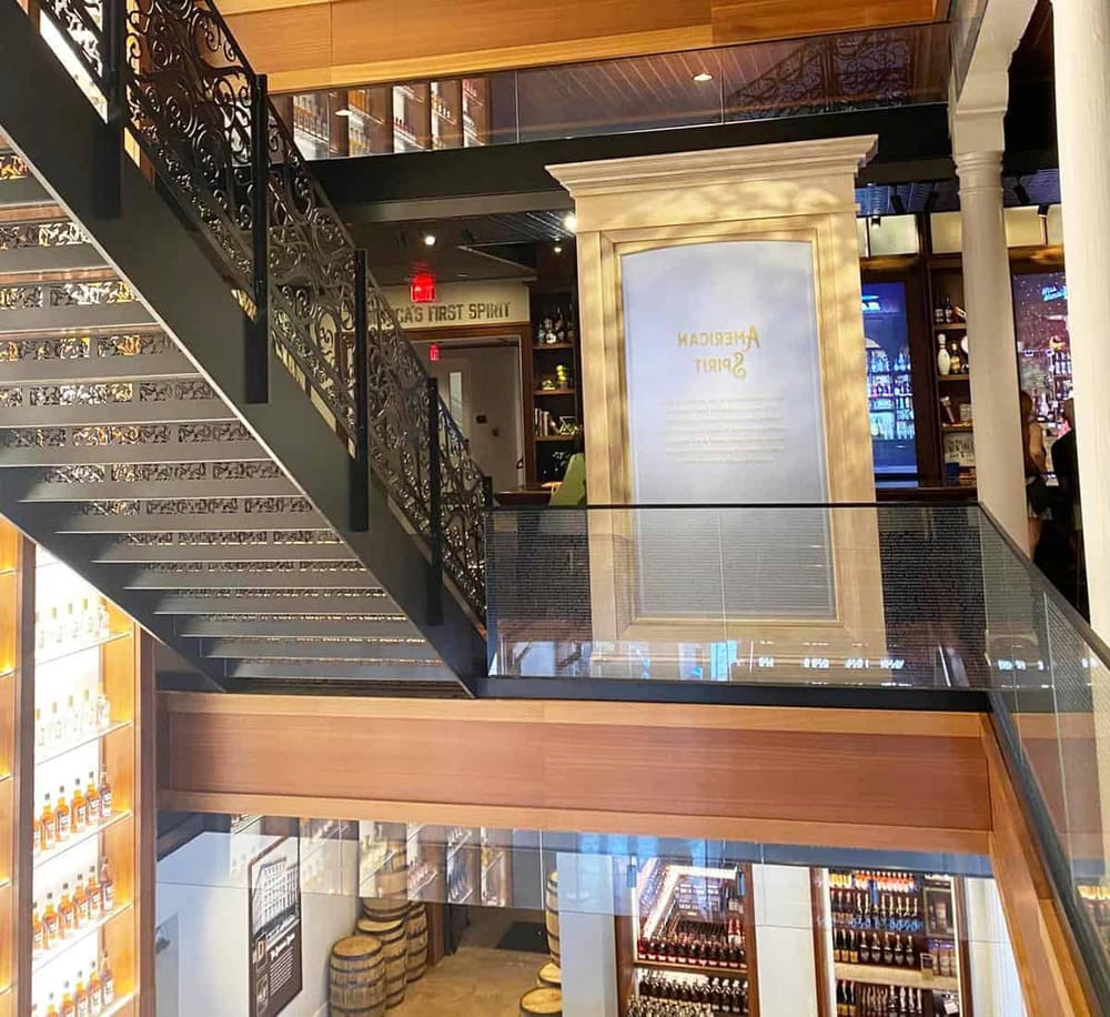 Luxurious restaurant interior with elegant staircase and modern decor for upscale dining experience.