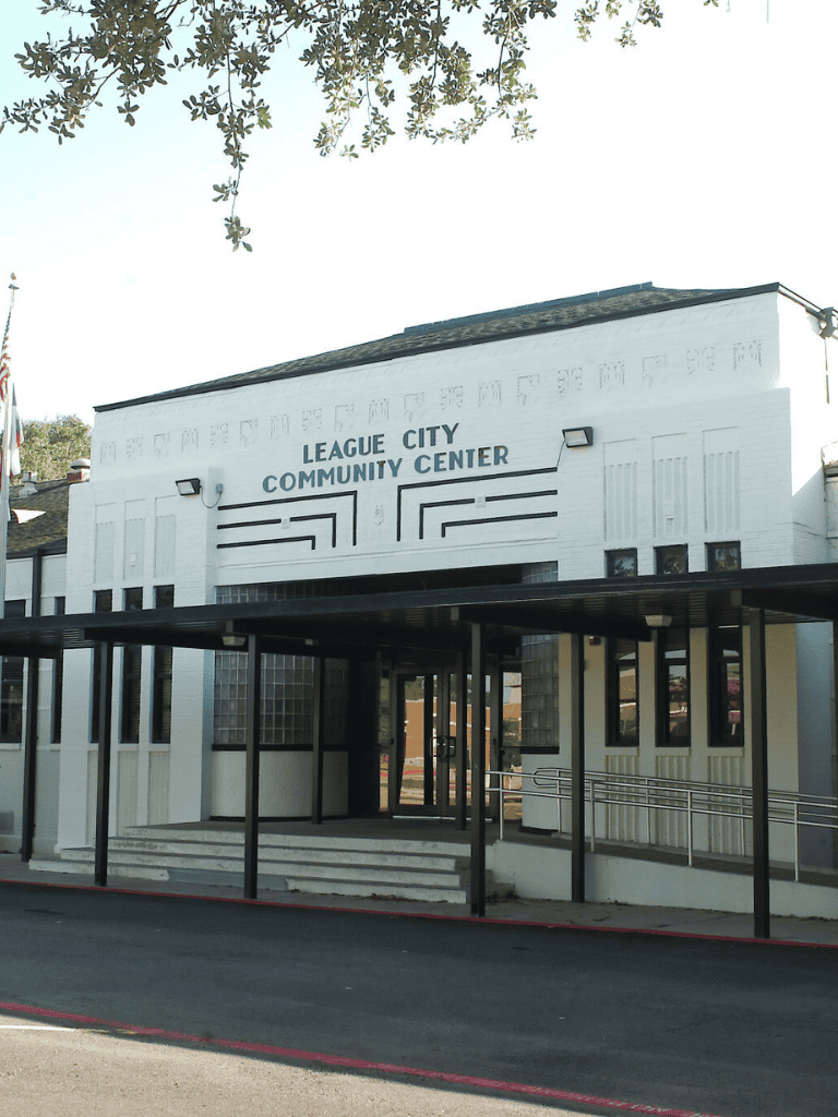 Accessible community center entrance with wheelchair ramp at League City Community Center.