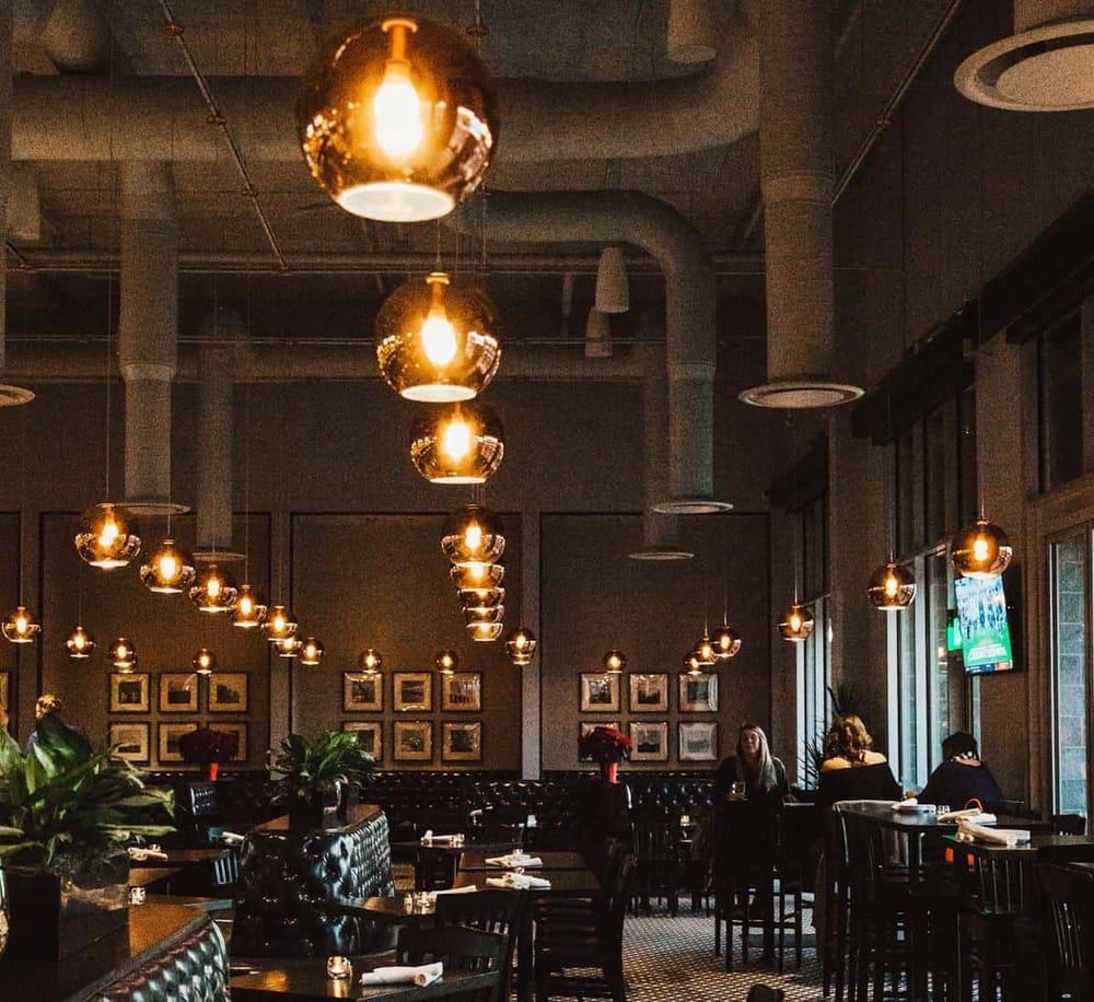 Warm lighting and stylish interior of a modern restaurant or cafe in Austin Texas.