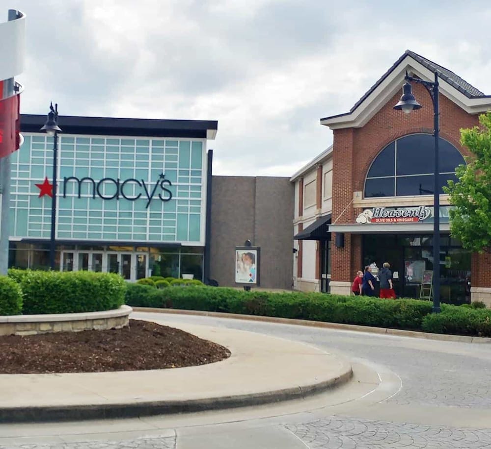 Macy's and Heavenly Olive Oils & Vinegars retail stores at a shopping mall.