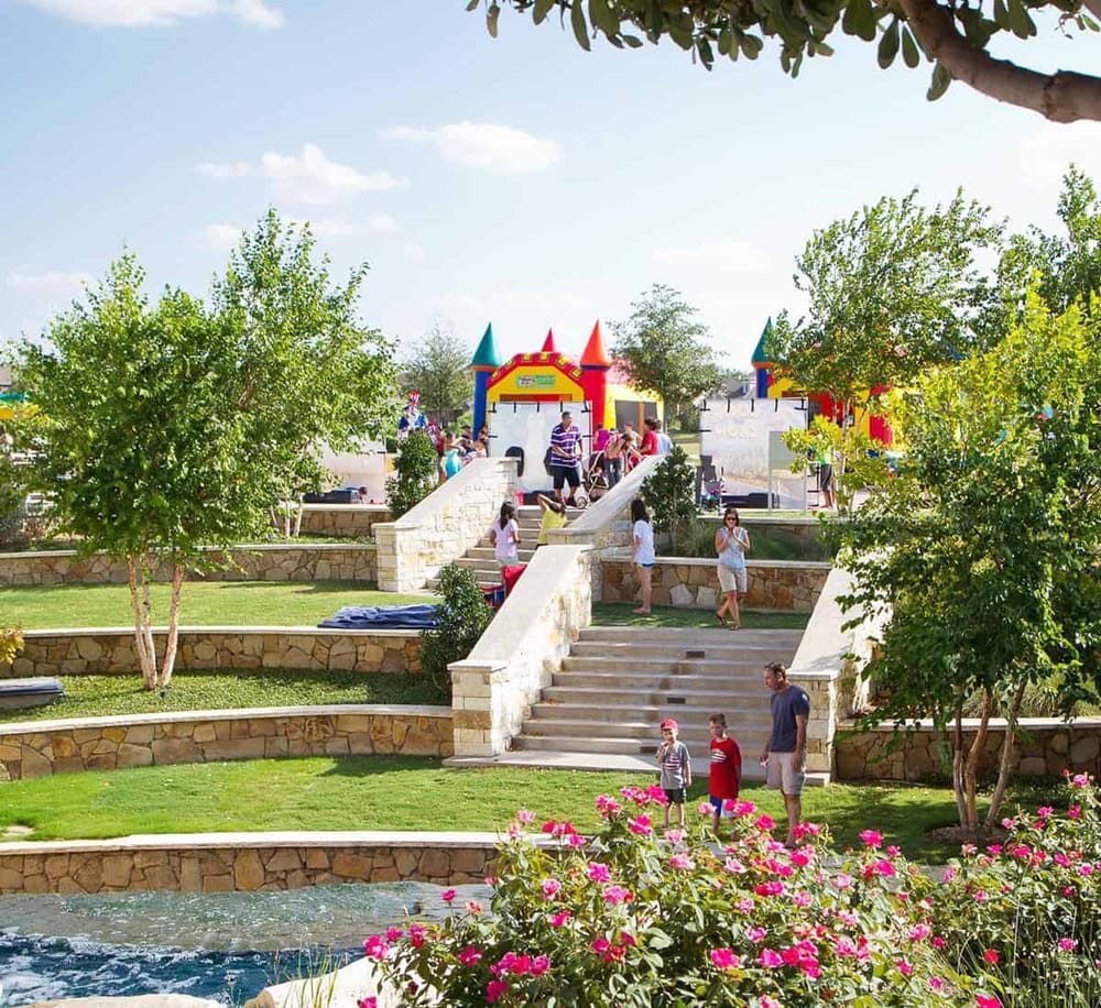 Colorful inflatable castle at Quest for Directions amusement park during daytime.