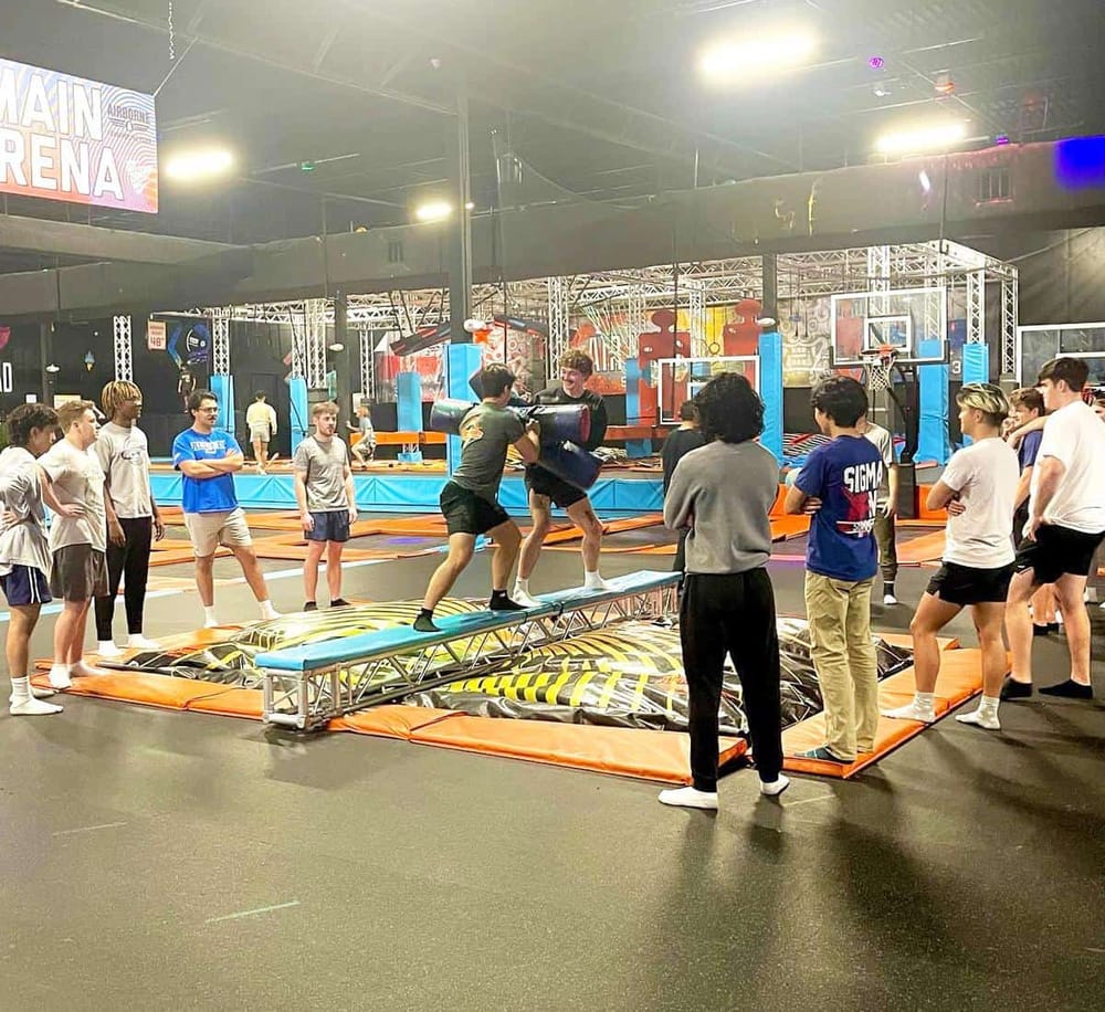 Kids playing trampoline dodgeball at Quest for Directions indoor trampoline park.