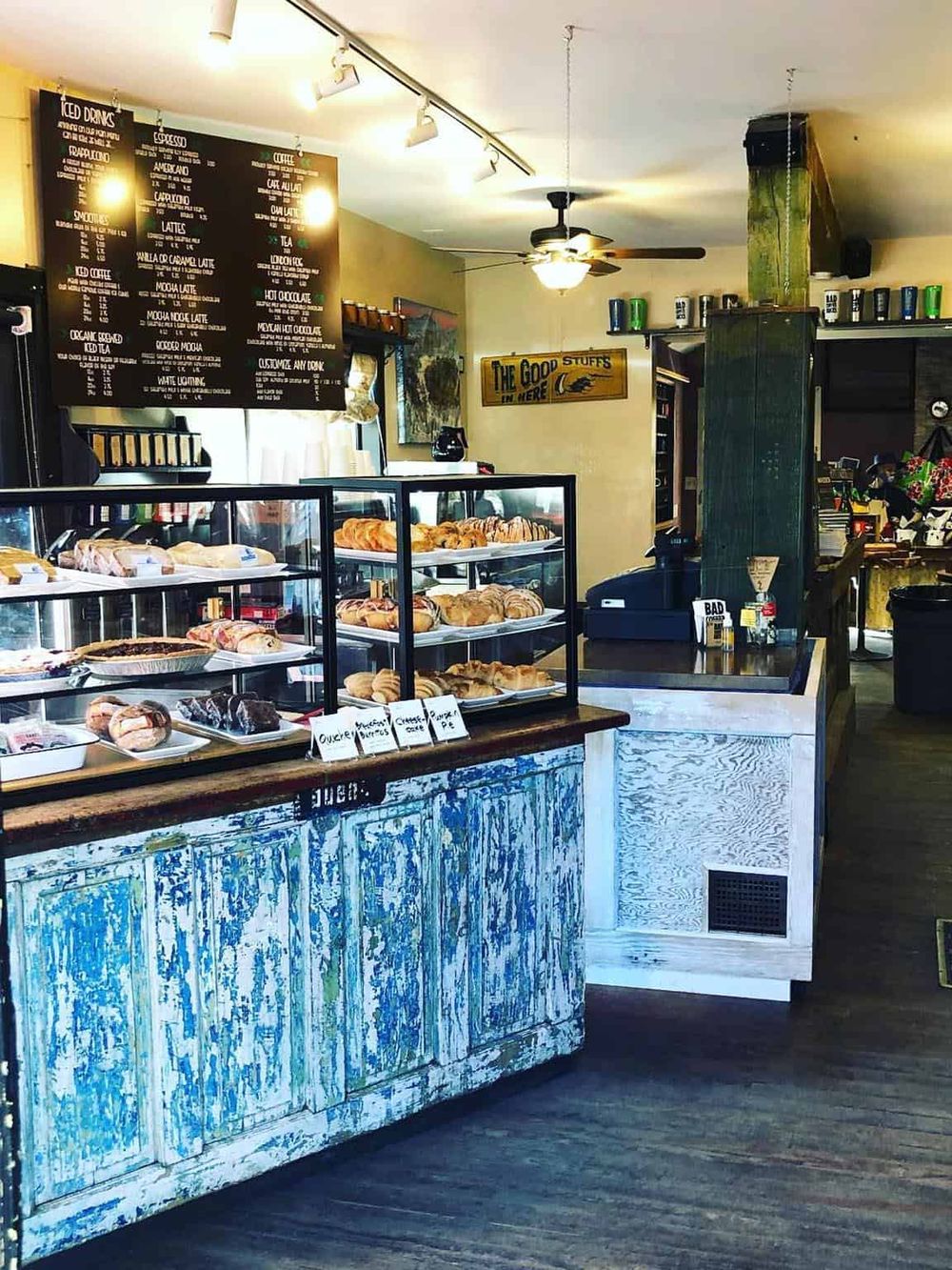 Fresh baked pastries and coffee counter at a cozy cafe, emphasizing quality breakfast and snack options, perfect for a local breakfast spot or brunch.