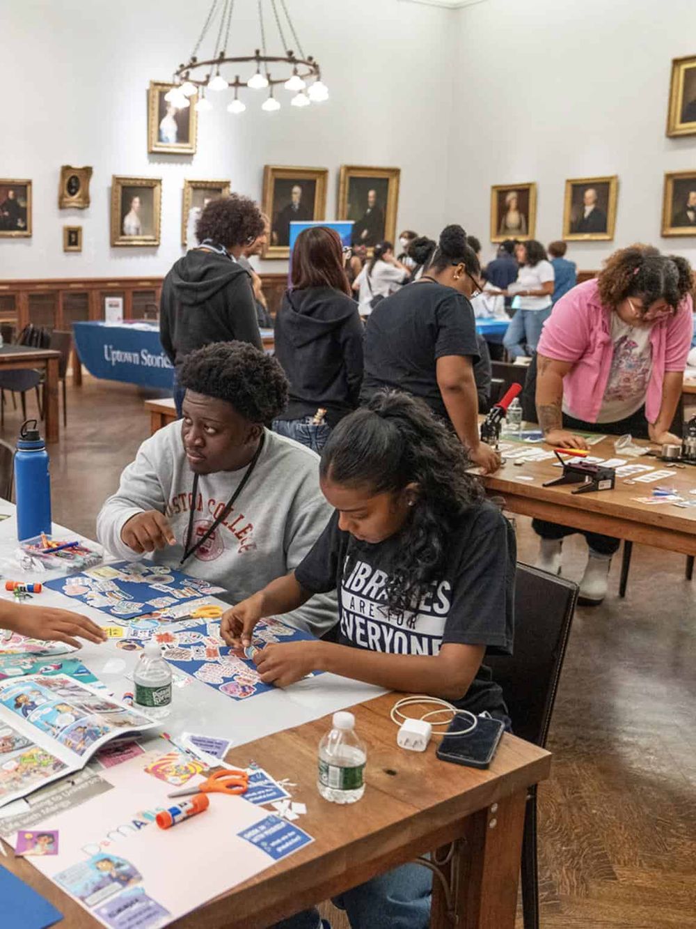 Creative workshop in a historic gallery space with diverse participants engaging in art projects at QuestForDirections.