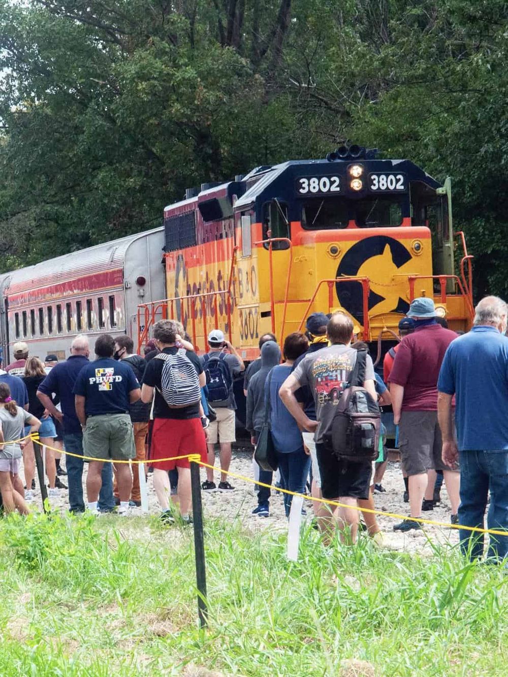 Vintage train rescue event at QuestForDirections scenic location, attracting crowds and train enthusiasts.