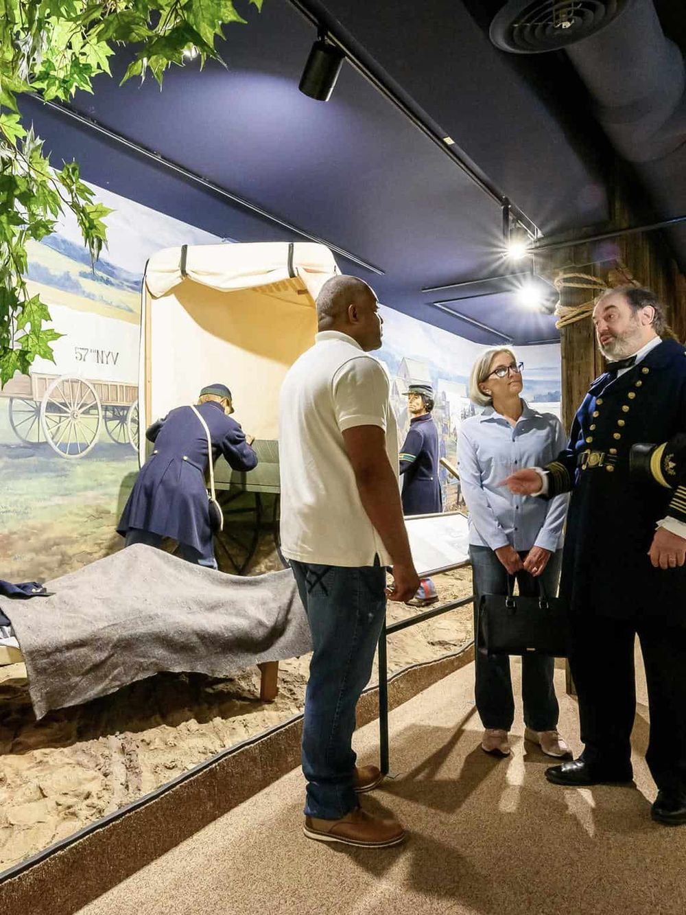 History museum exhibit with Civil War reenactors and interactive displays, educational experience about American history.