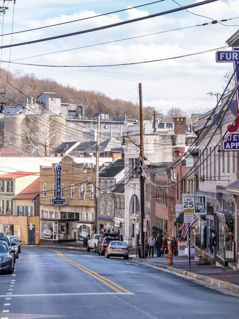 Charming small-town street with shops, cafes, and vintage buildings, captures the essence of local community and walkable downtown.