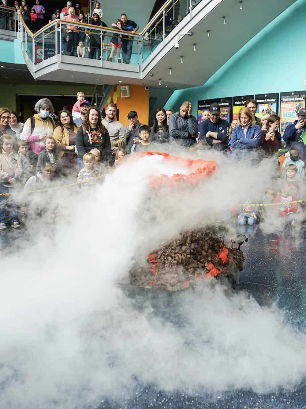 Vapeuver edifice erupting with smoke at QuestForDirections science exhibit.
