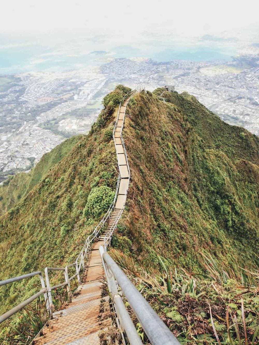 Climbing stairs on the iconic Table Mountain in Cape Town for breathtaking views.