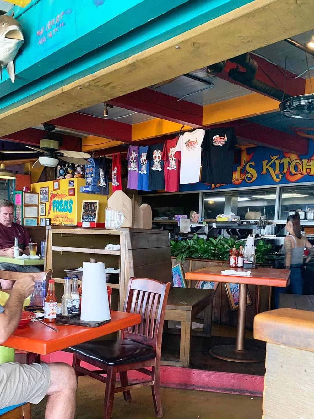 Colorful Mexican restaurant interior with vibrant decor and casual dining atmosphere.
