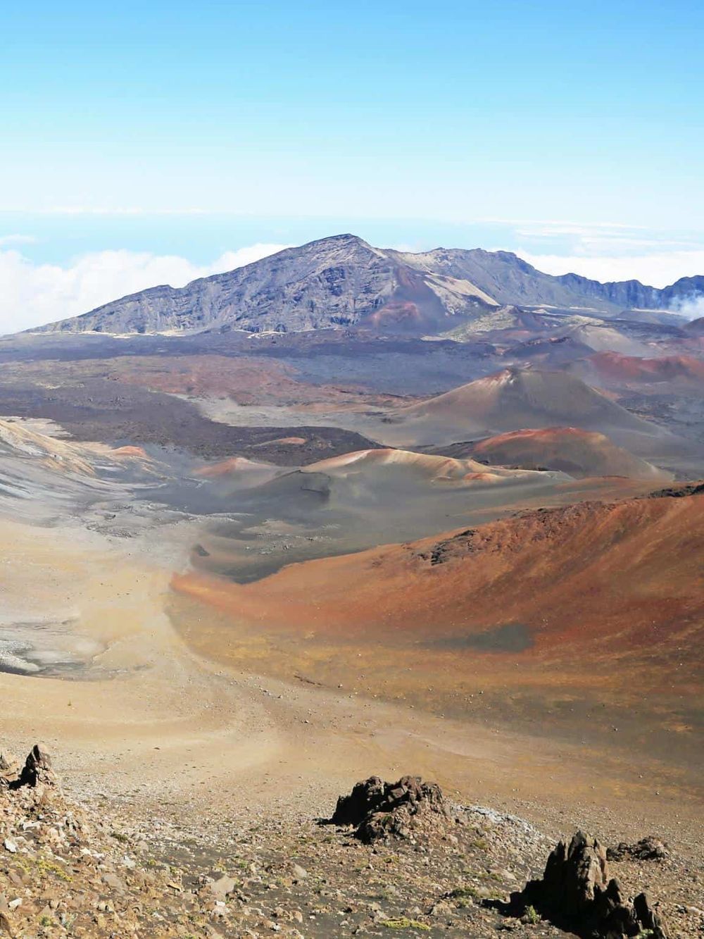 Volcano landscape with colorful volcanic sand and rugged terrain, part of QuestForDirections adventure travel.