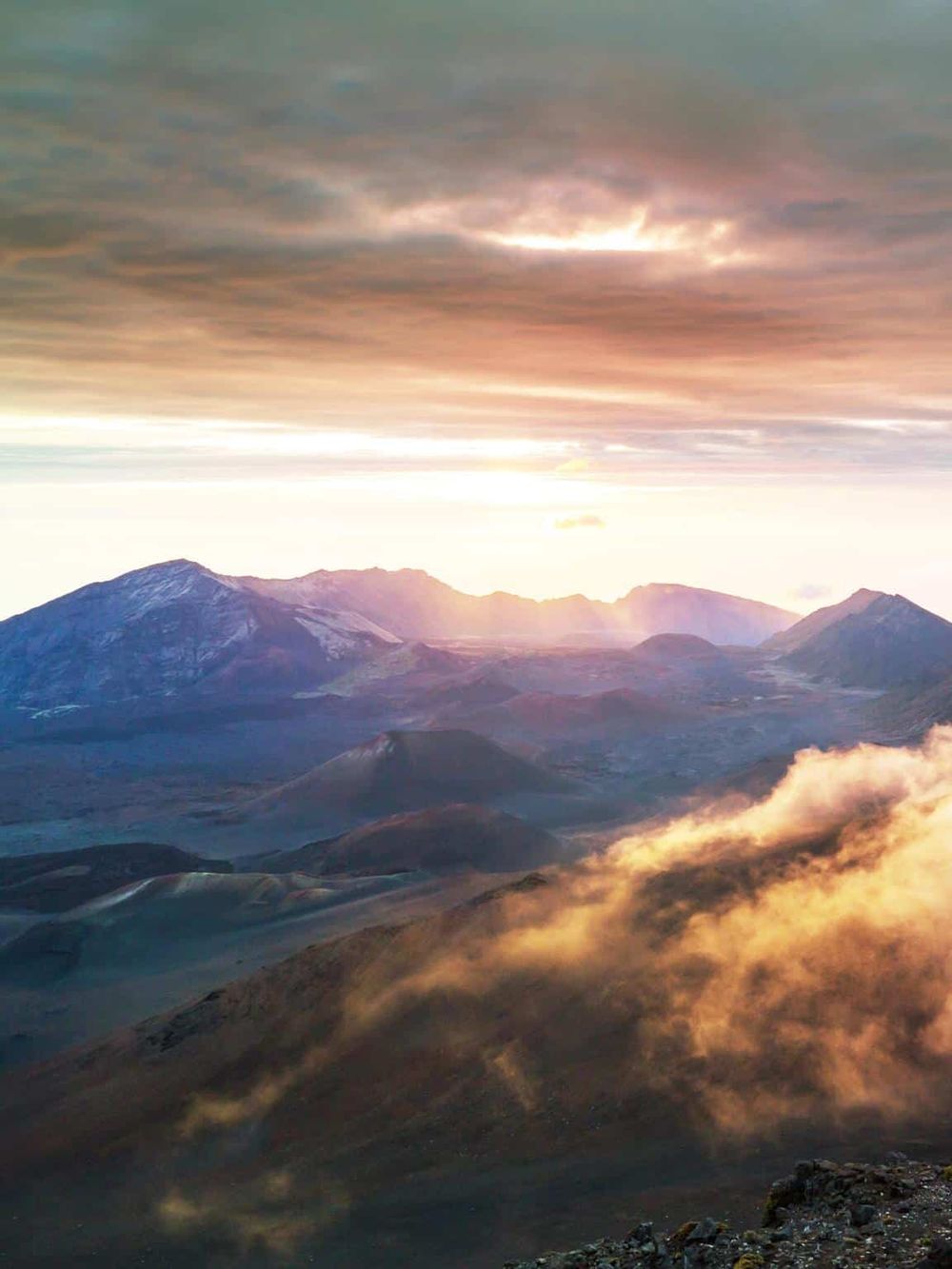 Breathtaking mountain landscape at sunrise with colorful sky, perfect for adventure and travel exploration.