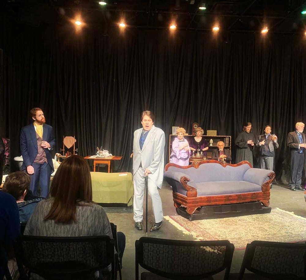 Thrilling theater performance with actors on stage, dramatic scene with elegant costumes, audience engaged, live acting in a drama production.