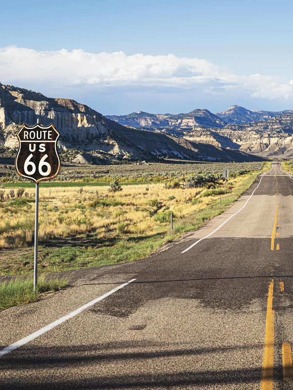 Scenic Route 66 landscape with mountains and open road, perfect for road trip adventures and travel planning.