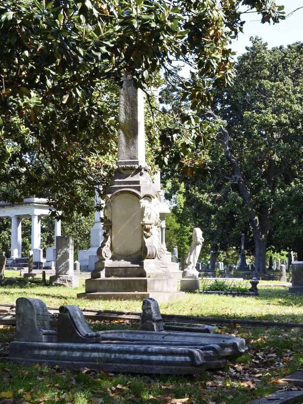 Ancient cemetery with historic gravestones and lush greenery, perfect for exploring local history and heritage.