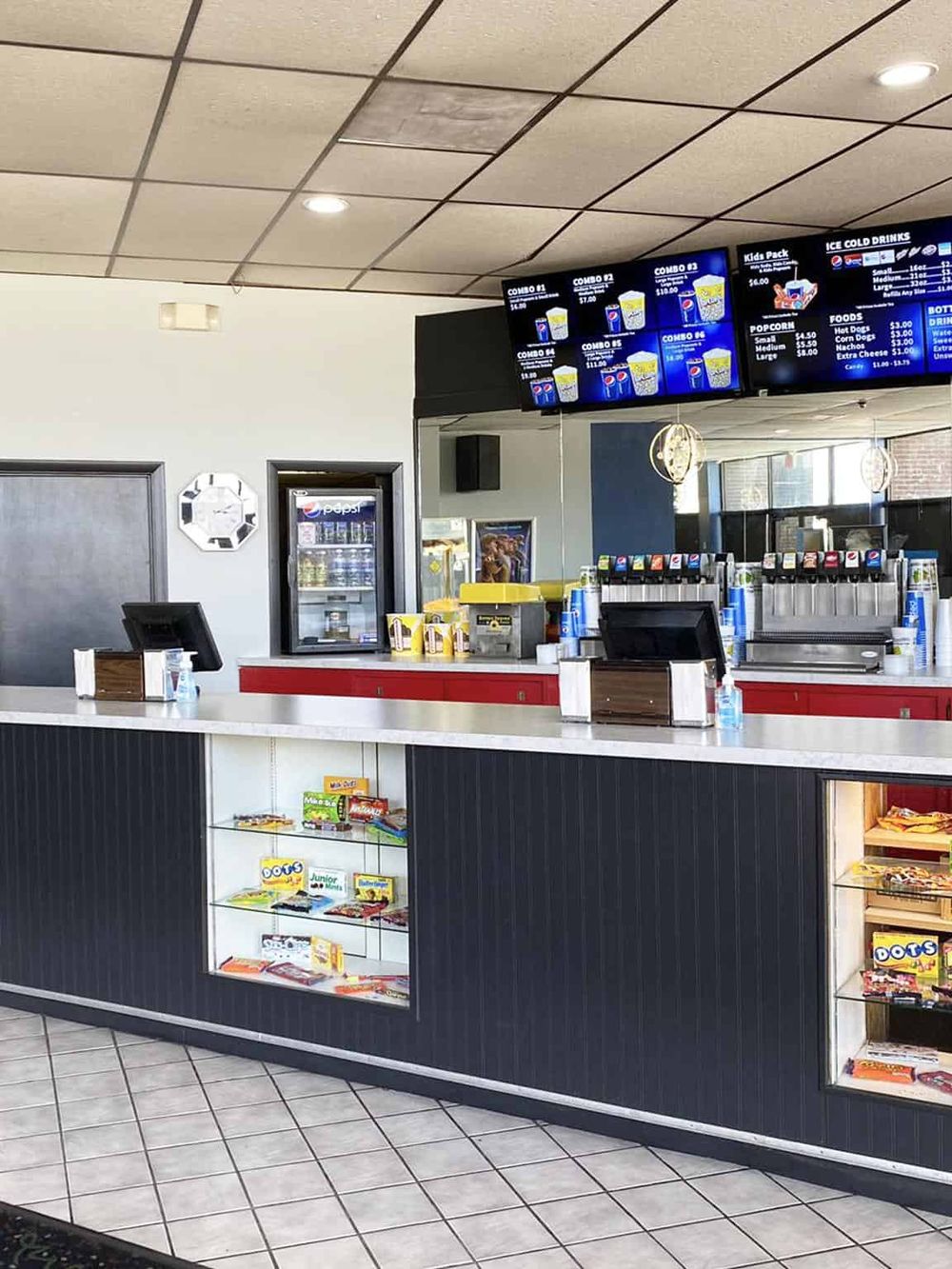 Point of Sale counter at a fast-food restaurant, digital menu, snacks, and beverages.