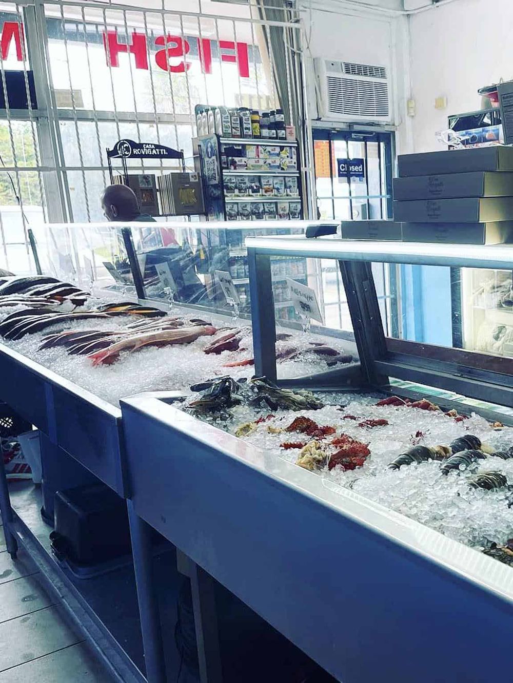 Fresh seafood and fish display case at QuestForDirections store, a popular retail destination for seafood lovers.