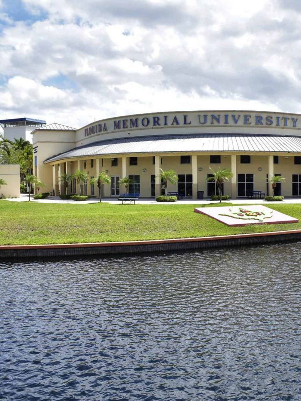 Historic Florida Memorial University campus with water view and lush landscaping.
