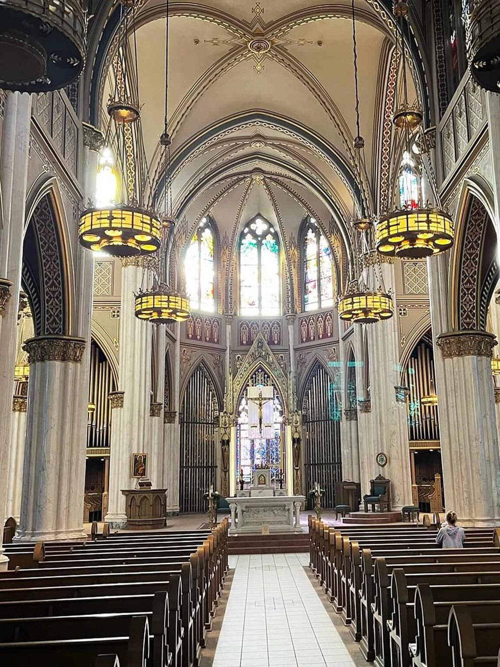 St. Mary's Cathedral interior with stained glass windows, vaulted ceilings, and ornate architectural details.