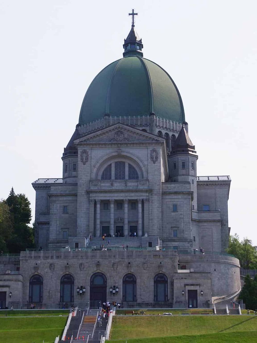 Majestic basilica with green dome, iconic religious landmark, and scenic surroundings.