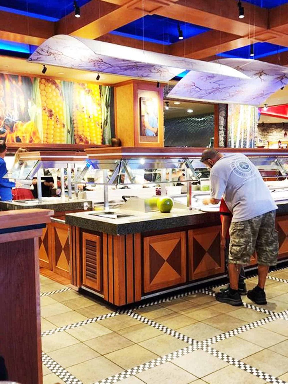 Fresh sushi buffet at QuestForDirections restaurant with vibrant decor and variety of Asian dishes.