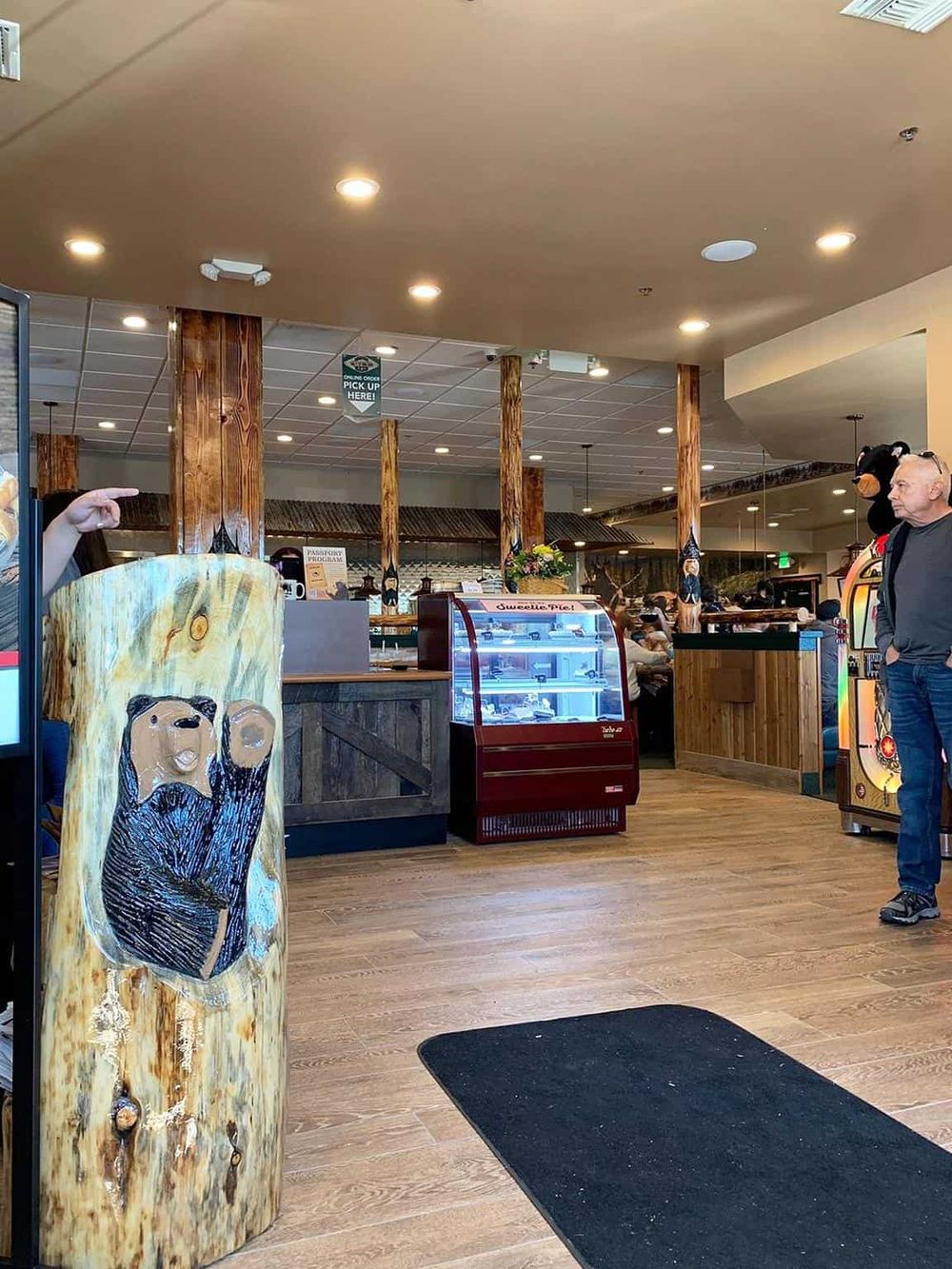 Colorful interior of a family-friendly restaurant with rustic wood accents and bear-themed decor.