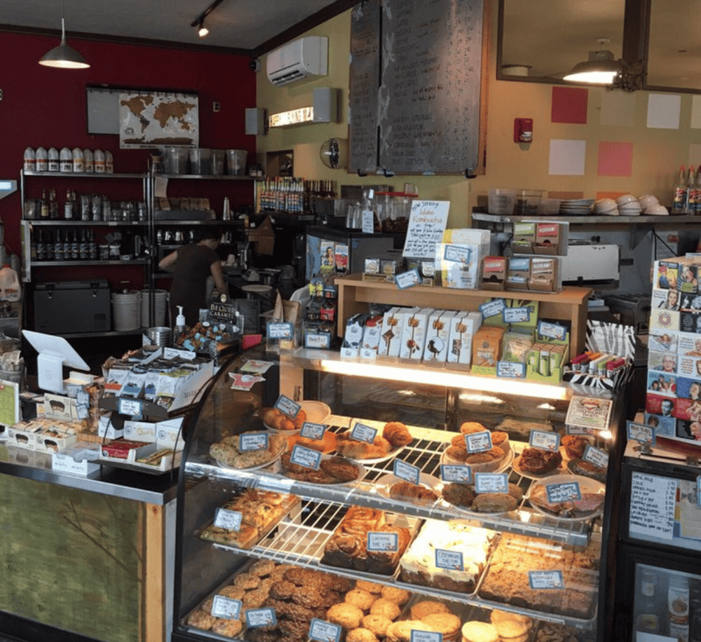 Freshly baked pastries and cookies at a cozy coffee shop bakery.