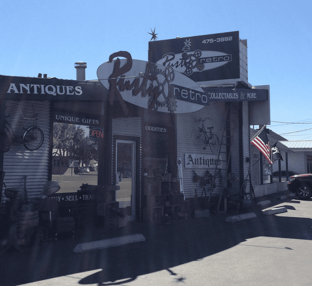 Antique and vintage collectibles store with retro decor, bicycles, and signs, perfect for unique gift shopping.