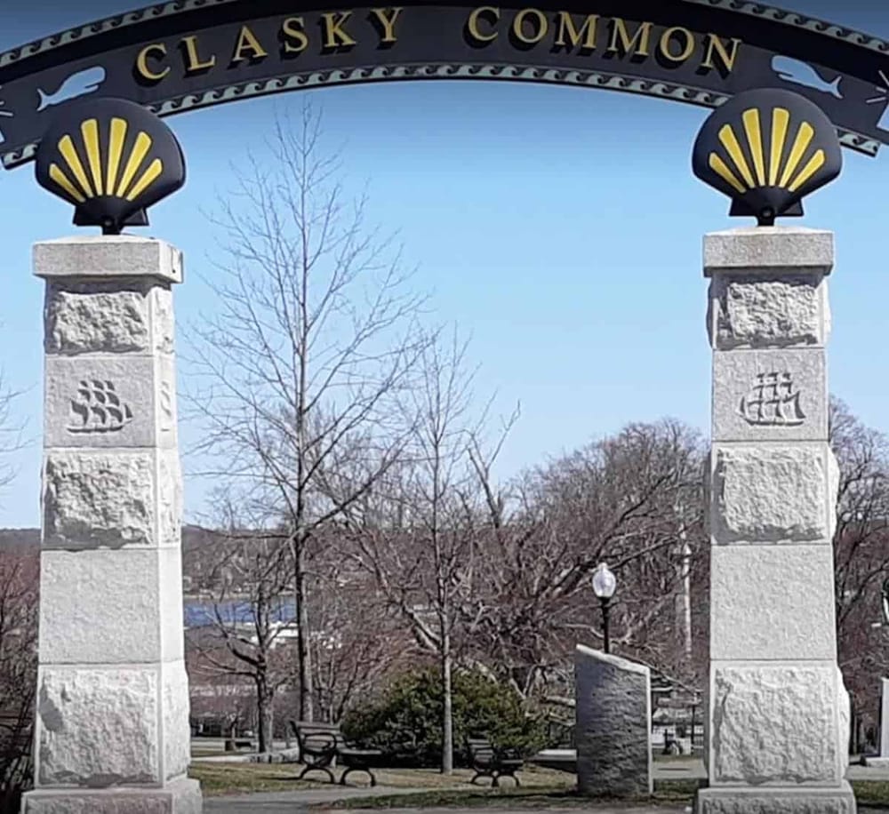 Historic Clasky Common Park entrance with stone pillars and maritime-themed decorations.