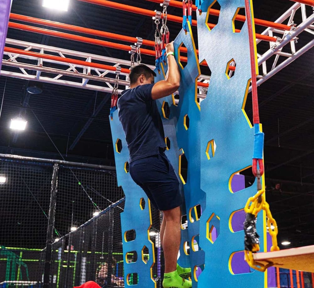 1. Indoor rock climbing obstacle course for adventure and fitness training.