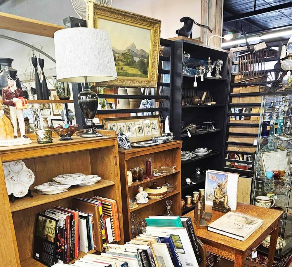 Vintage antique furniture and decor items at a thrift store or estate sale.