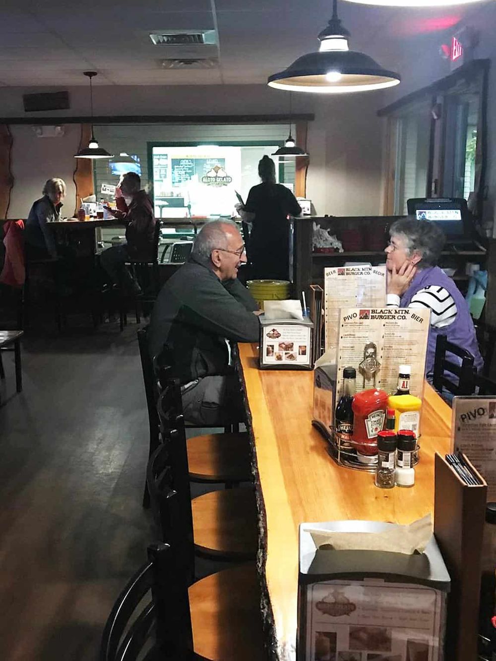 Cozy restaurant interior with customers dining and a bright, welcoming atmosphere, ideal for casual dining at QuestForDirections.