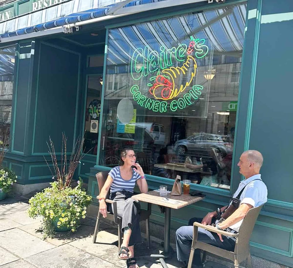 Fresh seafood restaurant with outdoor seating and neon signage in California.