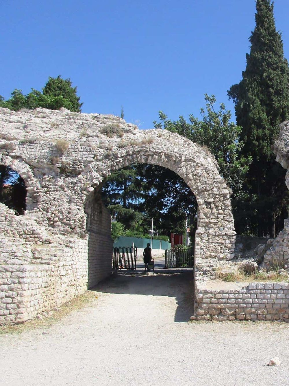 Ancient stone archway at QuestForDirections site, a historic landmark for cultural navigation.