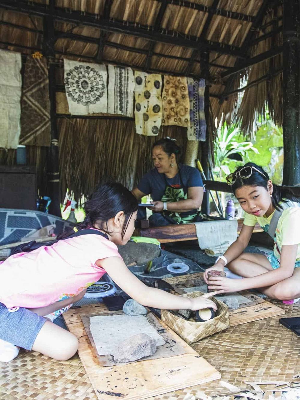 Exploring traditional crafts in a cultural hut, engaging in hands-on artisanal activities, and experiencing local heritage.