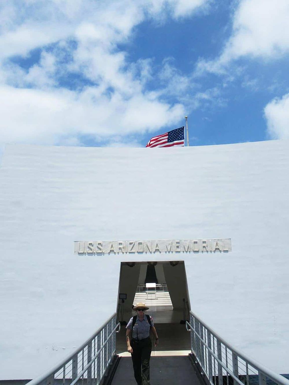 American flag on snow at USS Arizona Memorial, Pearl Harbor, Hawaii.