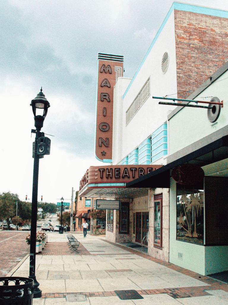 Marion Theatre entrance in a historic downtown street area.