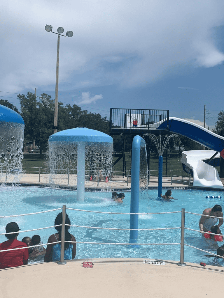 Fun water park with slides and splash pads for kids and families in QuestForDirections.