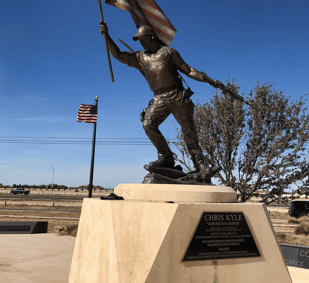 Heroic soldier statue honoring fallen service members and veterans at a memorial site.