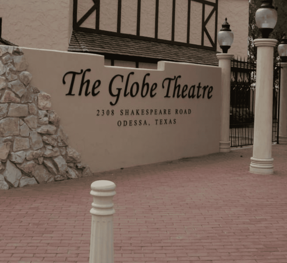 Elegant theater entrance with sign for The Globe Theatre in Odessa, TX | Famous regional performing arts venue.