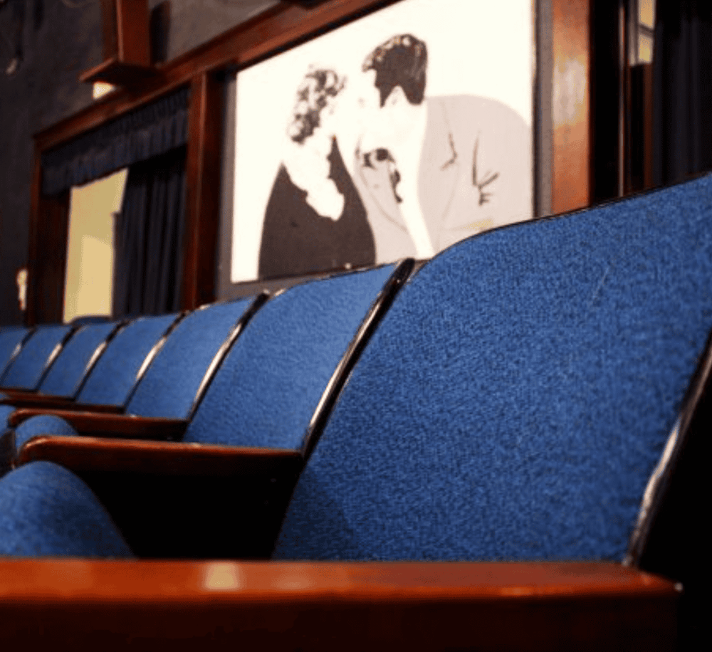 Comfortable blue theater seats at QuestForDirections venue.