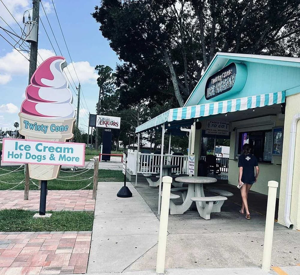 Colorful ice cream shop and sign for Twisty Cone, offering ice cream, hot dogs, and more at Quest for Directions.