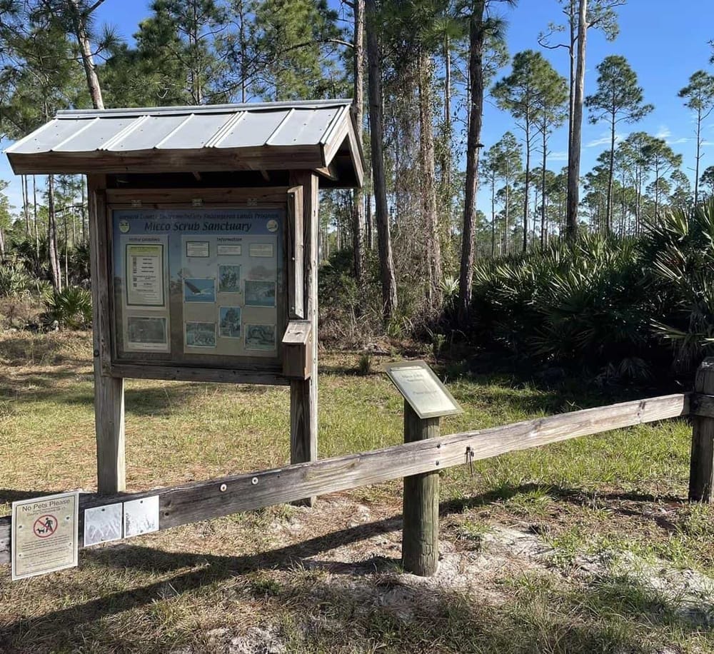 Native Florida nature preserve information board in the Mico Scrub Sanctuary.