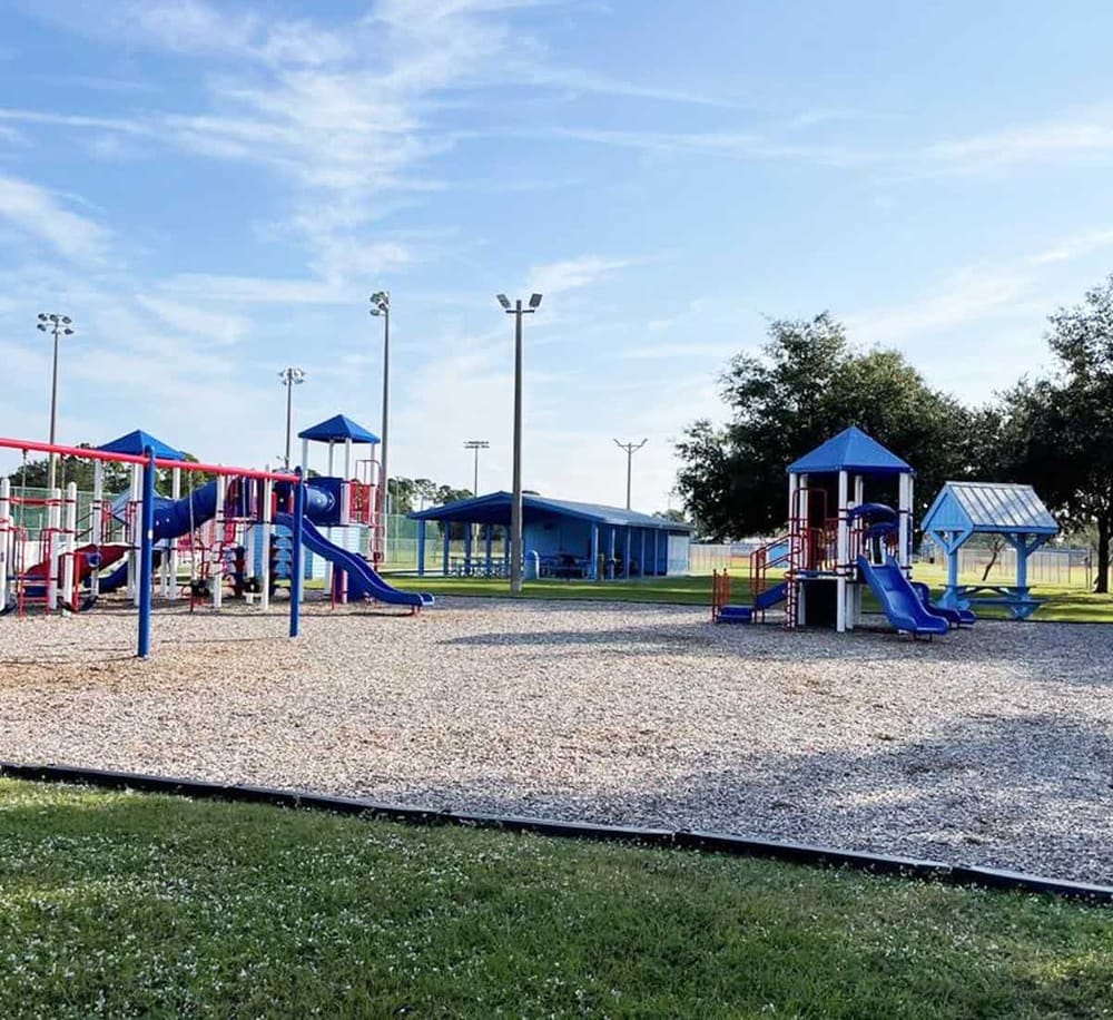Colorful children's playground with slides and swings at QuestForDirections park.
