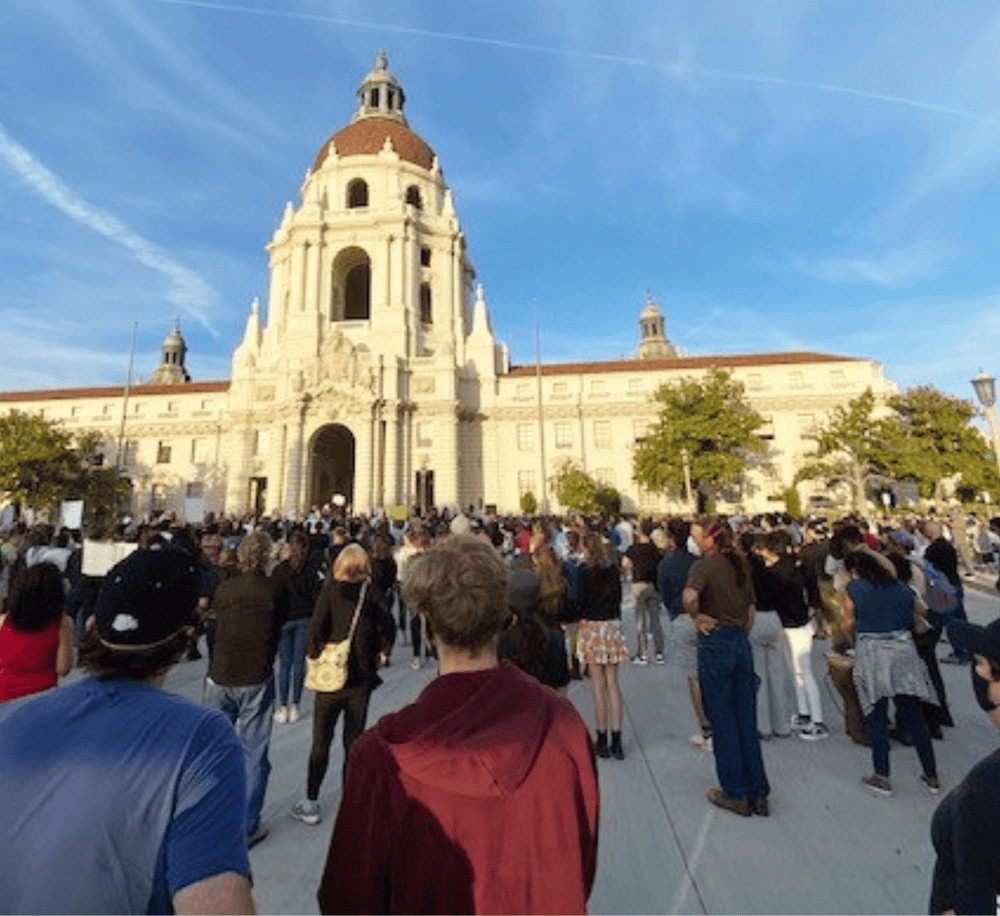 Crowd gathering outside historic building in San Francisco, showcasing travel and tourist destinations.