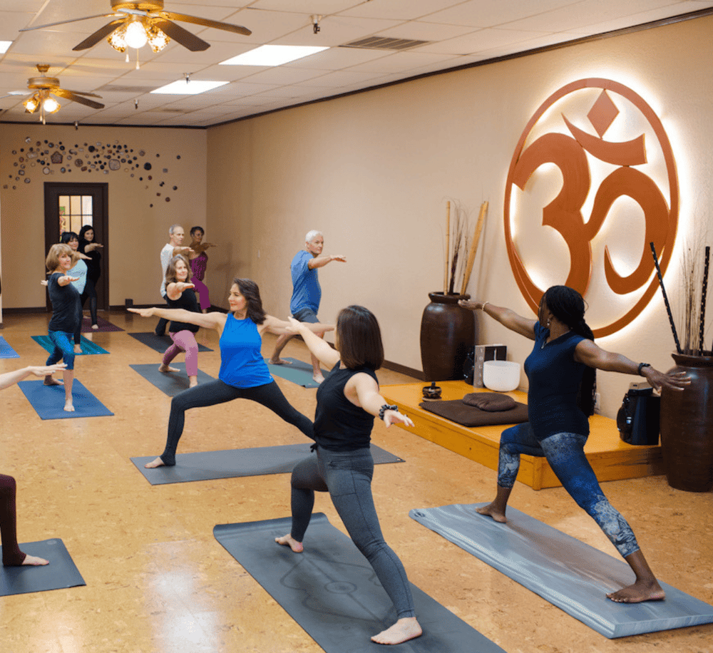 Peaceful yoga class in serene wellness studio, focusing on relaxation and mindfulness.